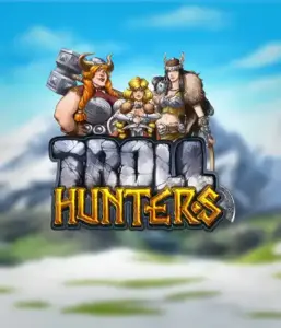 Графика игрового автомата "Troll Hunters" от Play'N Go, где изображены три викинга: две женщины и один мужчина, облаченные в традиционные викингские доспехи. За их спинами виднеются заснеженные горы, что добавляет атмосферу скандинавской мифологии. Этот игровой автомат идеален для поклонников скандинавской культуры и поисков приключений.